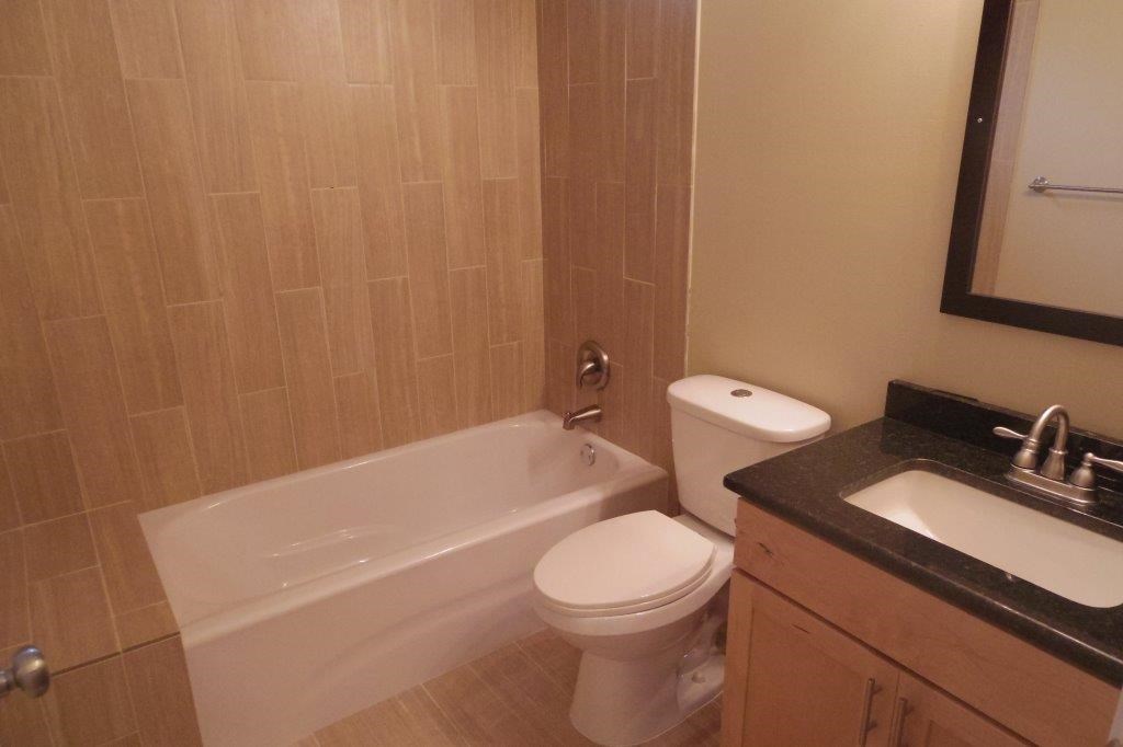 3504 Speedway, Unit A&B Austin, TX 78705 - Photo 14 of 29 a bathroom with a toilet a sink and bathtub
