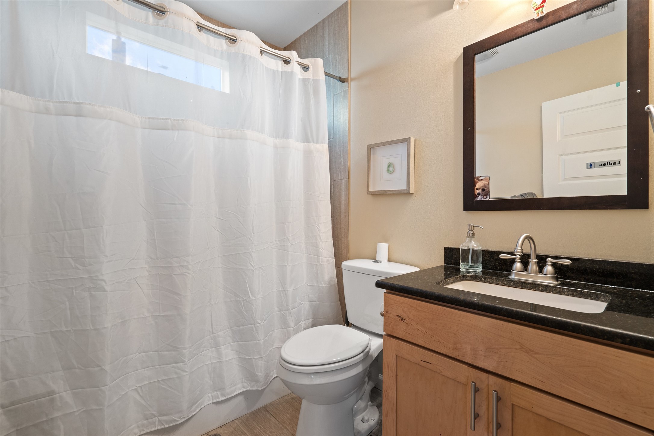3504 Speedway, Unit A&B Austin, TX 78705 - Photo 16 of 29 a bathroom with a sink a toilet and a mirror