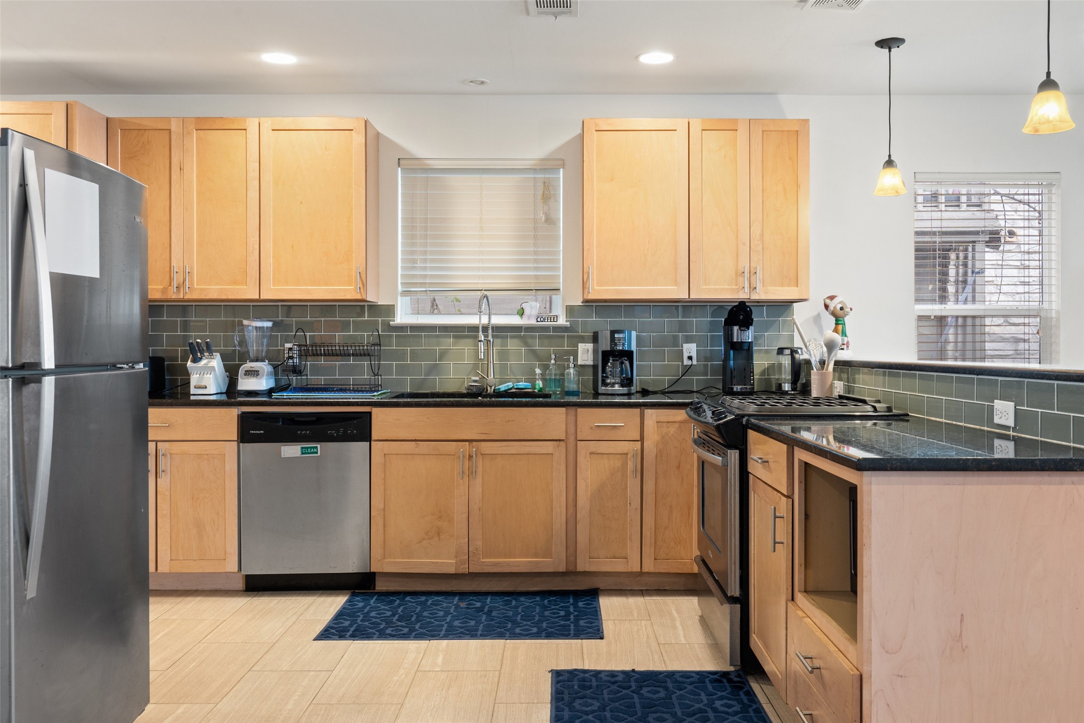 3504 Speedway, Unit A&B Austin, TX 78705 - Photo 2 of 29 a kitchen with stainless steel appliances granite countertop a refrigerator a sink a stove a microwave and island