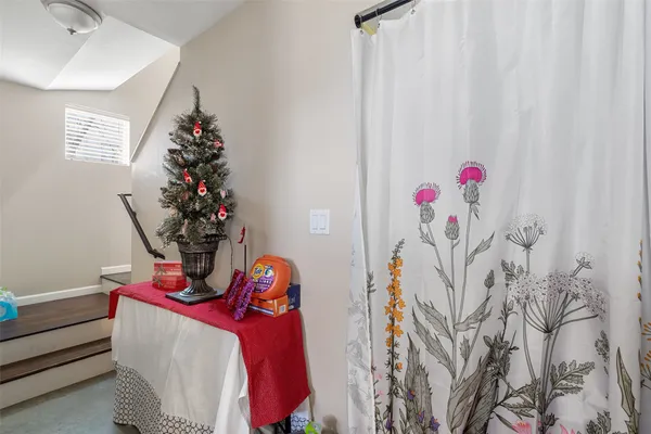 a living room with furniture and flowers
