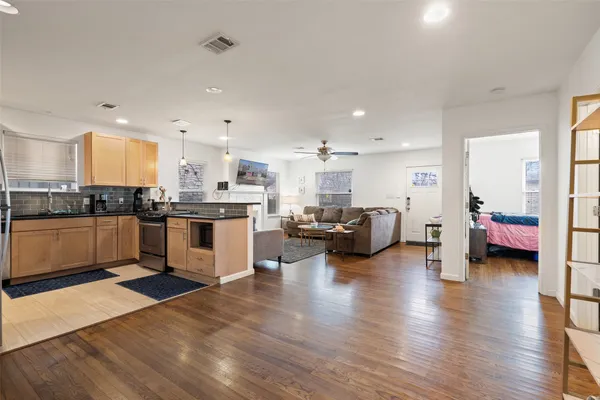 a kitchen with sink and cabinets