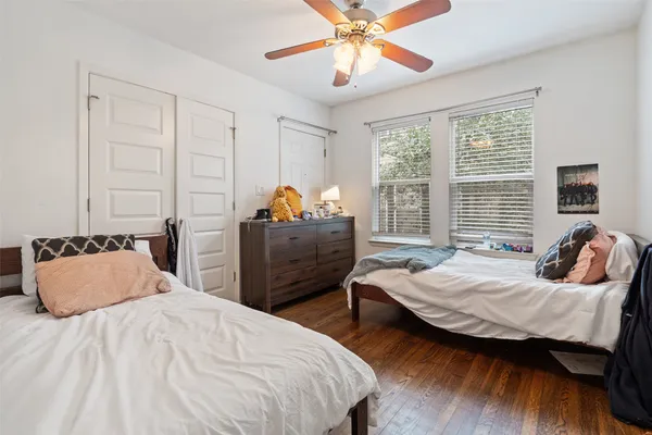a bedroom with bed and window