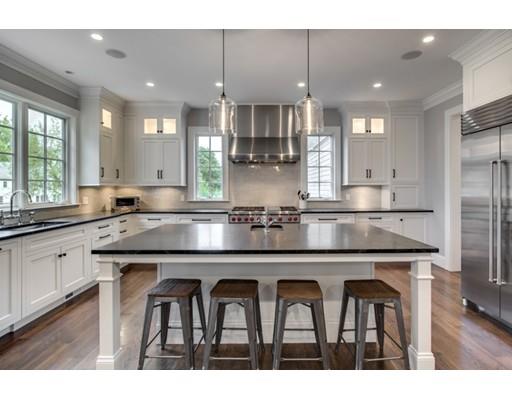 77 Edwardel Road Needham, MA 02492 - Photo 2 of 10 a kitchen with stainless steel appliances granite countertop a sink a stove a refrigerator and white cabinets