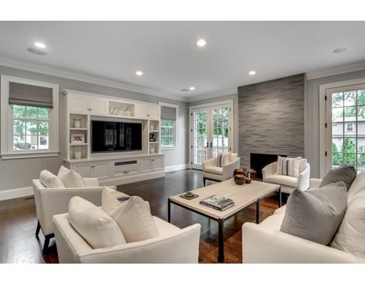 77 Edwardel Road Needham, MA 02492 - Photo 7 of 10 a living room with furniture a flat screen tv and a fireplace