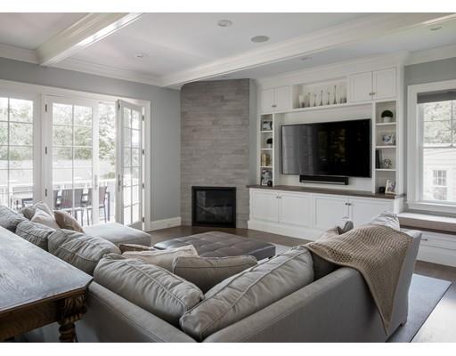 77 Edwardel Road Needham, MA 02492 - Photo 8 of 10 a living room with furniture ceiling fan and a flat screen tv