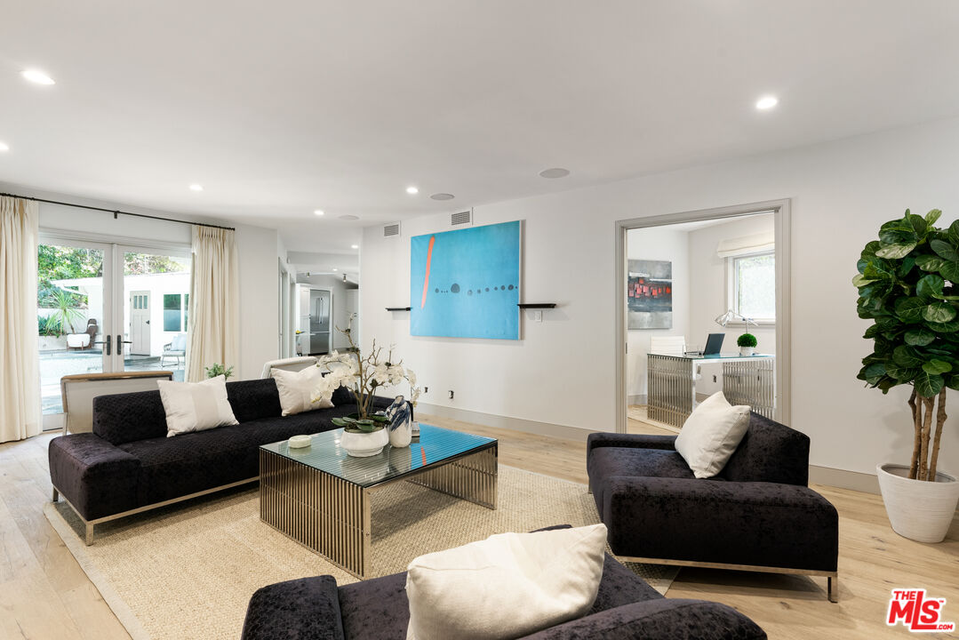 1104 Acanto Place Los Angeles, CA 90049 - Photo 12 of 39 a living room with furniture and a large window