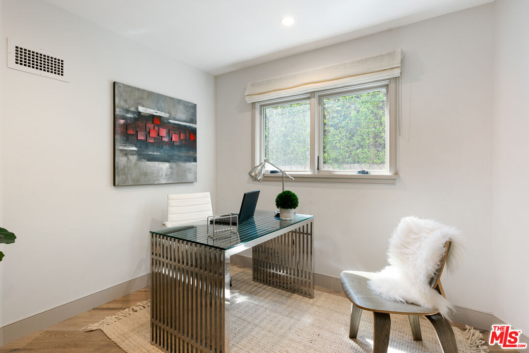 1104 Acanto Place Los Angeles, CA 90049 - Photo 13 of 39 a living room with furniture and a window