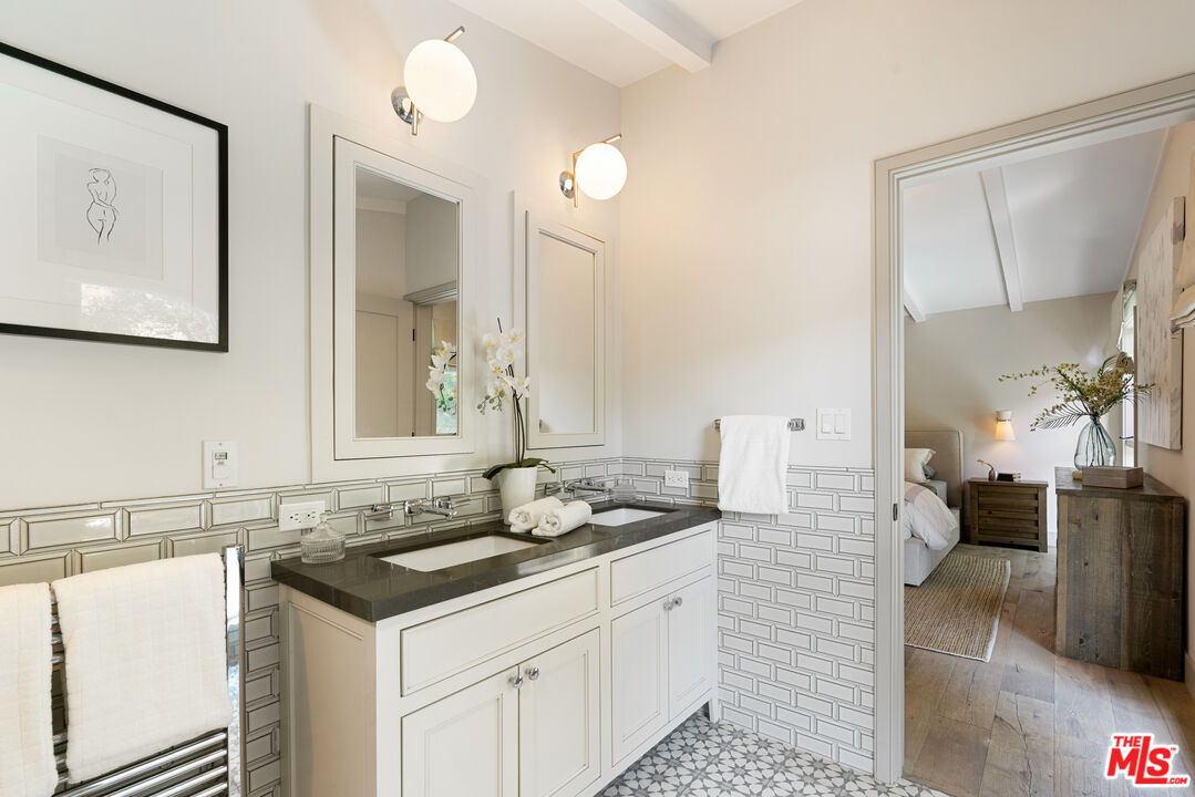1104 Acanto Place Los Angeles, CA 90049 - Photo 18 of 39 a bathroom with a sink and a mirror
