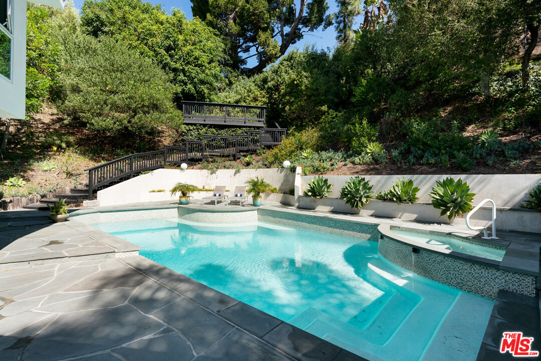 1104 Acanto Place Los Angeles, CA 90049 - Photo 25 of 39 a view of swimming pool with a patio