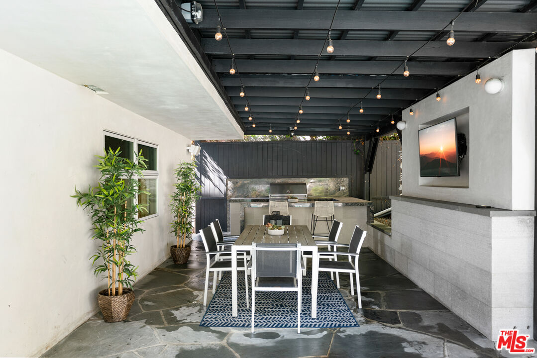 1104 Acanto Place Los Angeles, CA 90049 - Photo 31 of 39 a view of a dining room with furniture