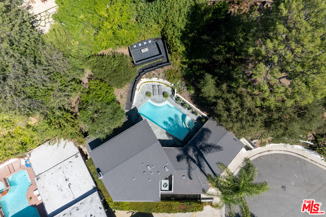 1104 Acanto Place Los Angeles, CA 90049 - Photo 37 of 39 an aerial view of a house with garden space and sitting area