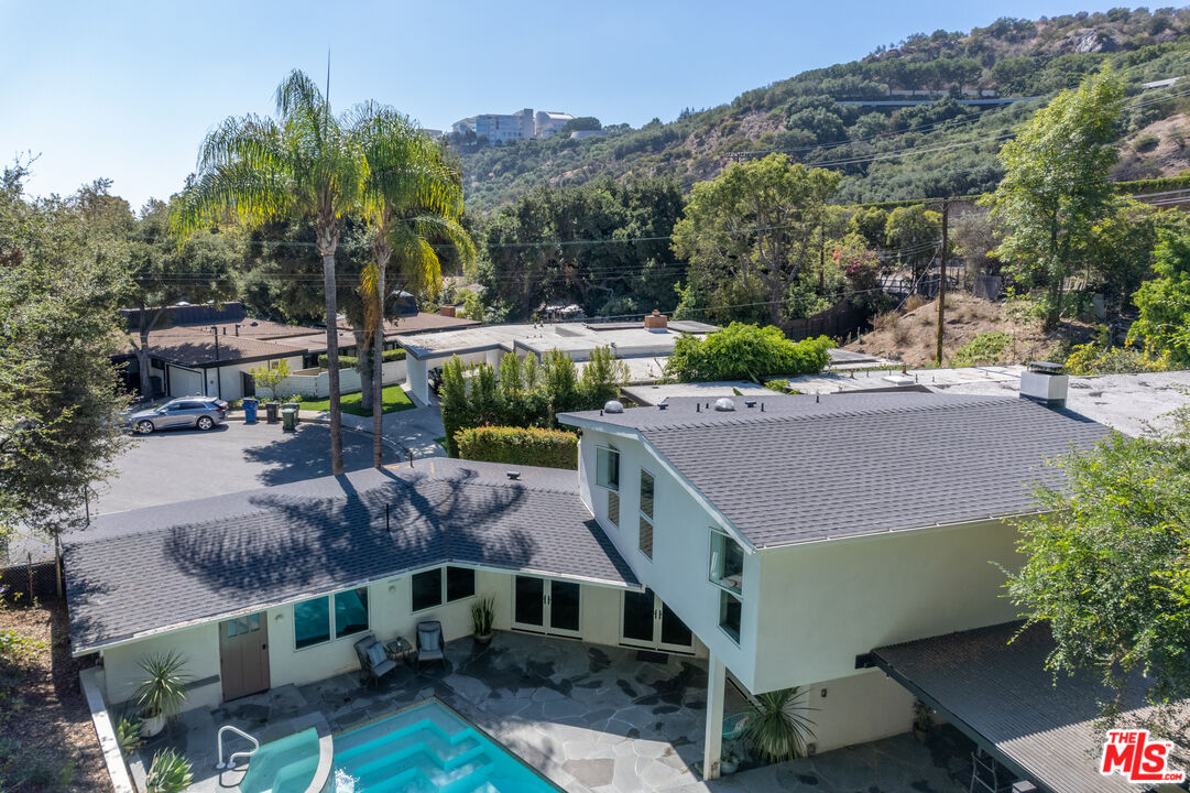 1104 Acanto Place Los Angeles, CA 90049 - Photo 38 of 39 a aerial view of a house with a yard