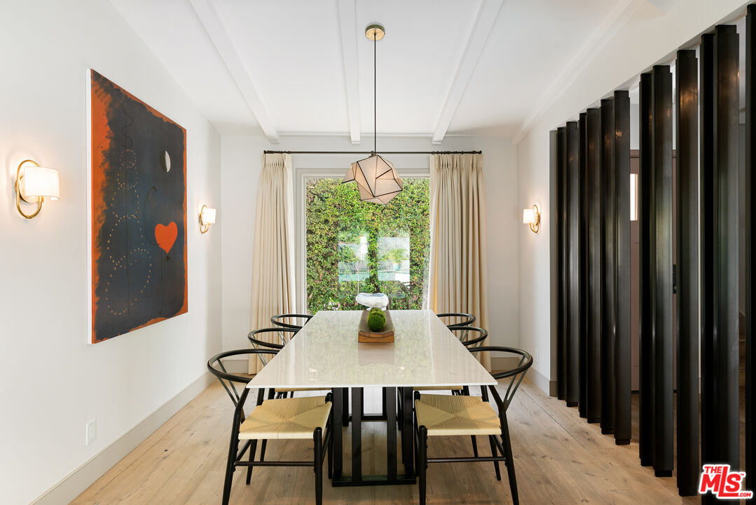 1104 Acanto Place Los Angeles, CA 90049 - Photo 4 of 39 a view of a dining room with furniture window and outside view