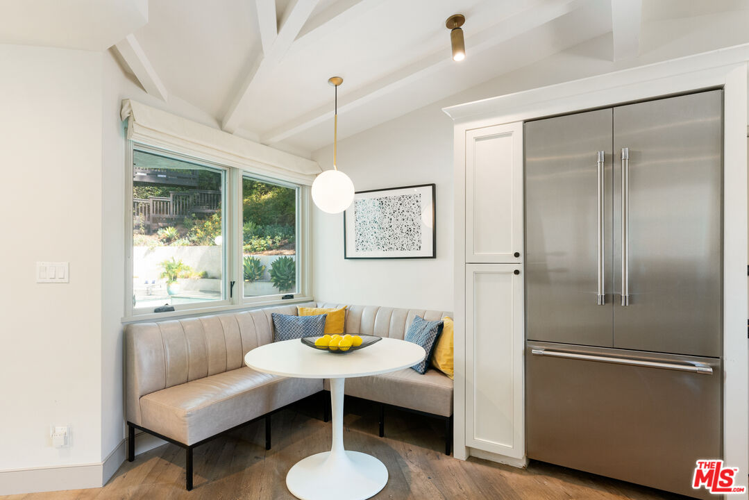 1104 Acanto Place Los Angeles, CA 90049 - Photo 8 of 39 a living room with a couch and a table