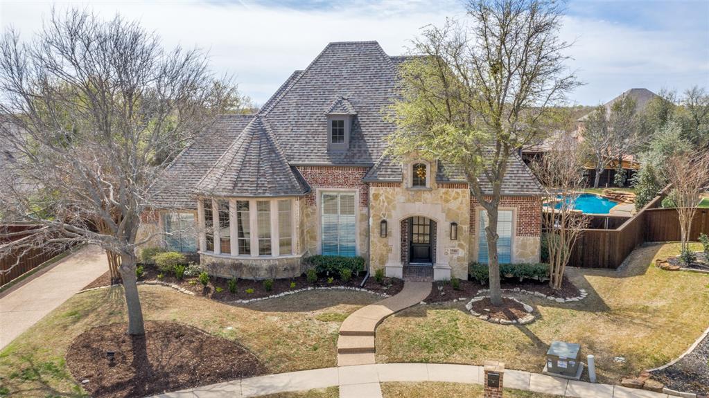 7301 Hampstead Court McKinney, TX 75071 - Photo 1 of 40 a front view of a house with garden and trees