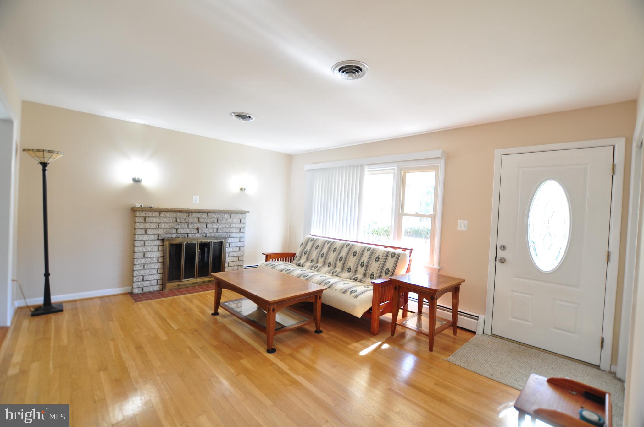 7909 Rocky Road Gaithersburg, MD 20882 - Photo 8 of 31 Living Room Wood Burning Fireplace!