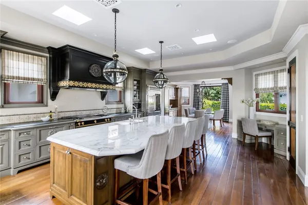 a kitchen with granite countertop a sink and cabinets