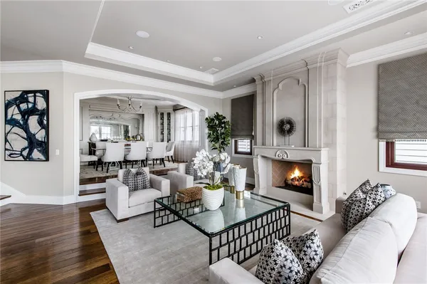 a living room with fireplace furniture and a flat screen tv