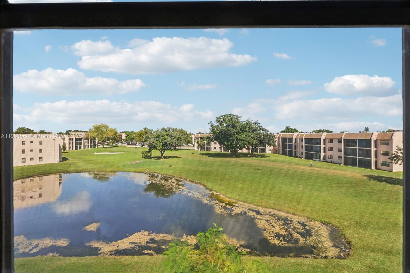 2793 Northwest 104th Avenue, Unit 401 Sunrise, FL 33322 - Photo 22 of 28 a view of a lake with a big yard