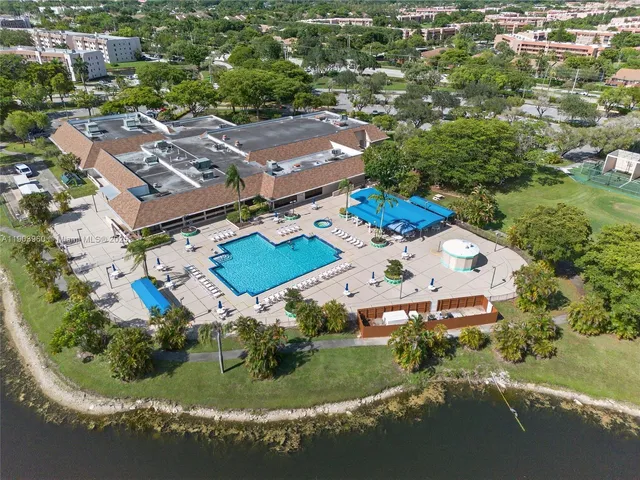 an aerial view of residential house with outdoor space and parking