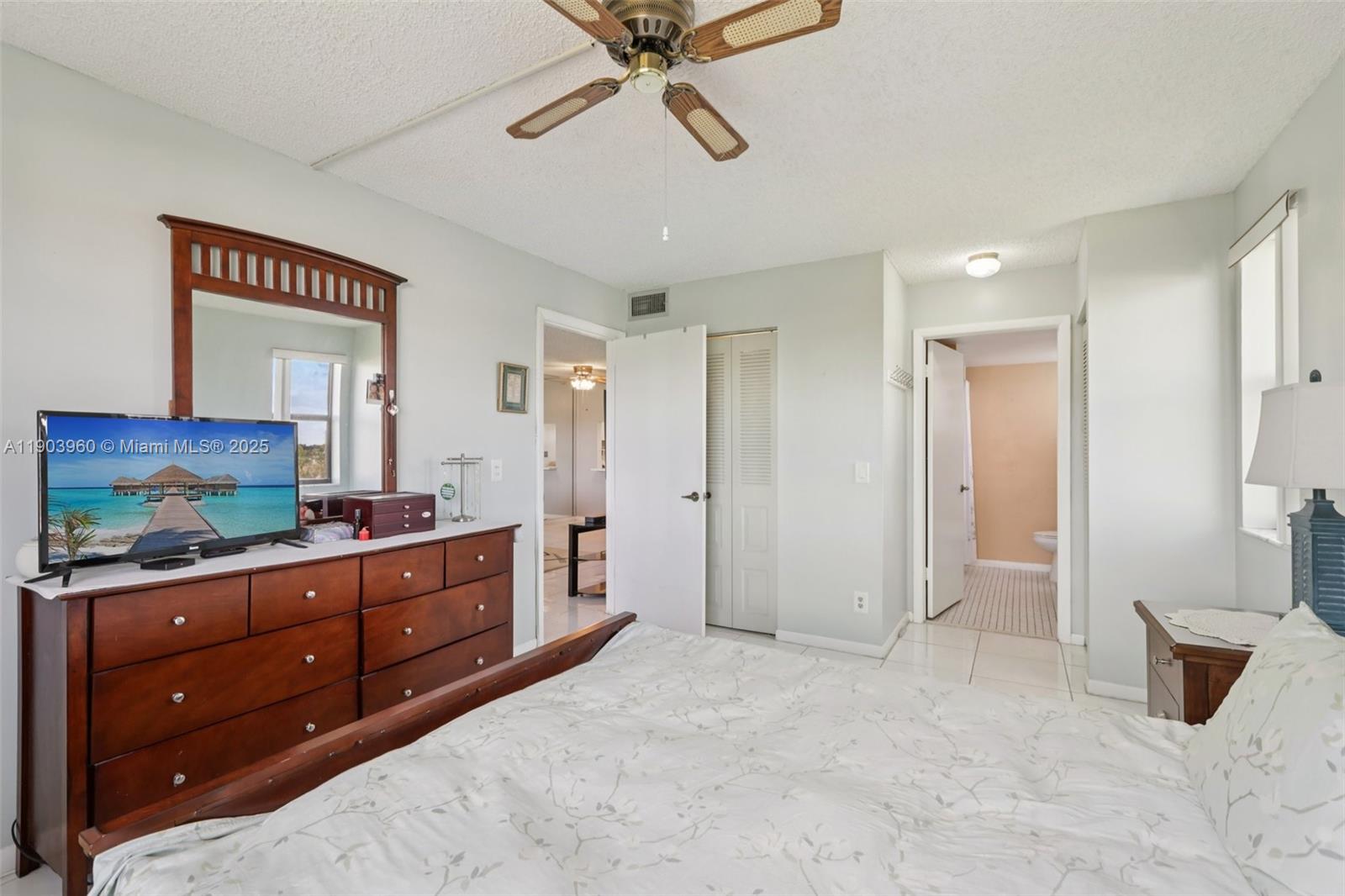 2793 Northwest 104th Avenue, Unit 401 Sunrise, FL 33322 - Photo 28 of 28 a room with two cabinet and a flat screen tv