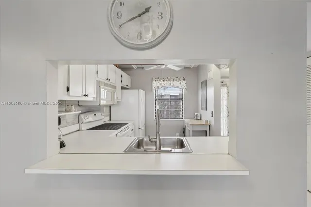 a view of kitchen with wooden floor