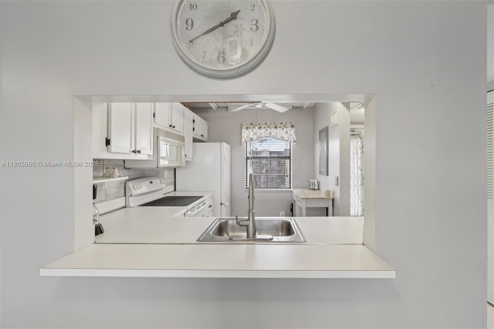 2793 Northwest 104th Avenue, Unit 401 Sunrise, FL 33322 - Photo 7 of 28 a view of kitchen with wooden floor