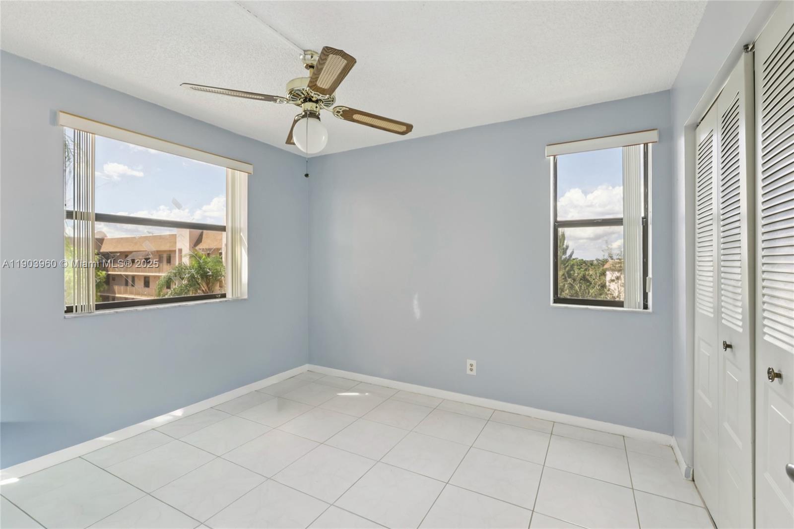 2793 Northwest 104th Avenue, Unit 401 Sunrise, FL 33322 - Photo 9 of 28 a view of an entryway and wooden floor