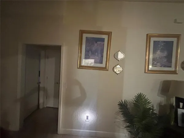 a view of hallway with window and flower pot