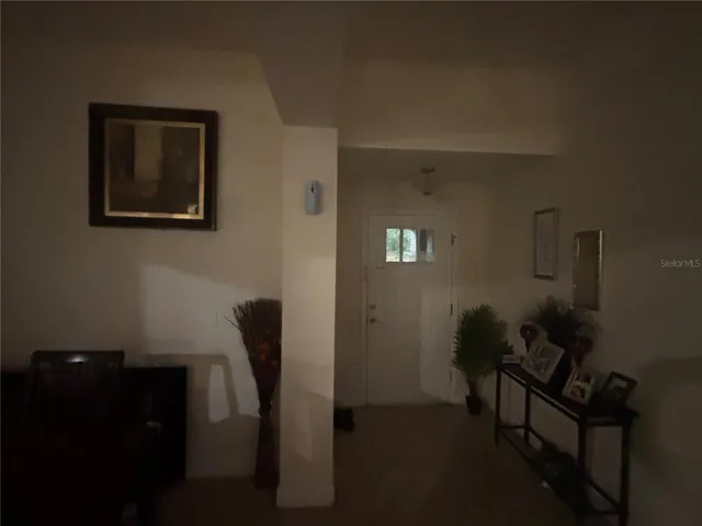 a view of a livingroom with furniture and a window