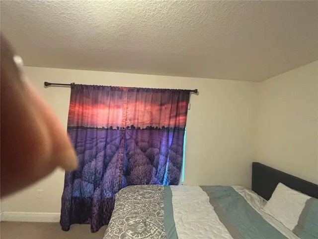 a bathroom with a toilet and shower