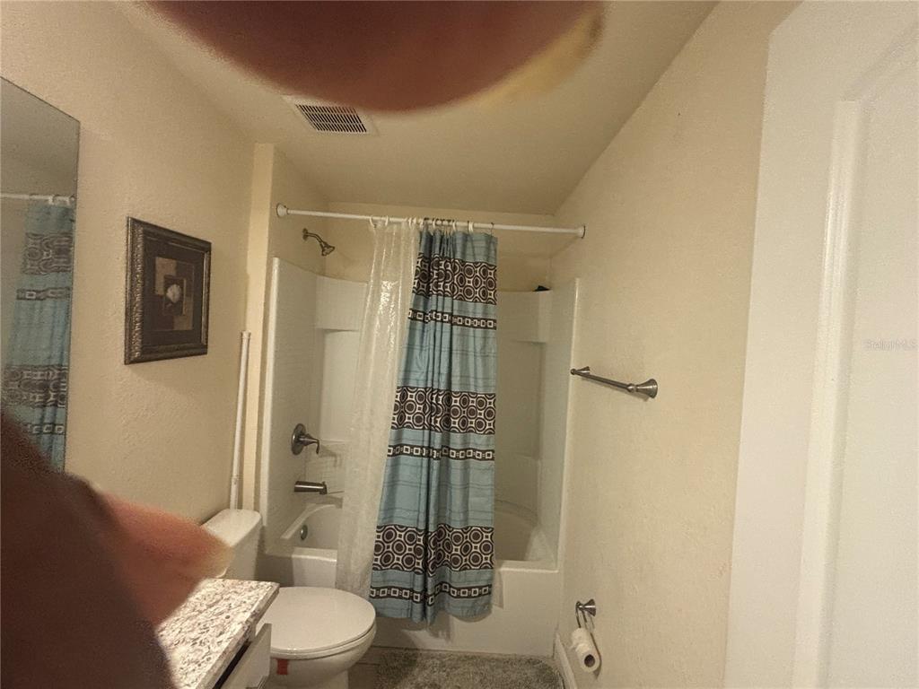 12214 Legacy Bright Street Riverview, FL 33578 - Photo 16 of 16 a bathroom with a toilet and shower