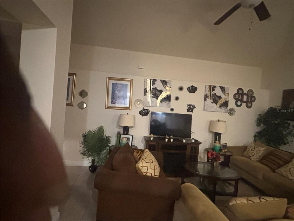 12214 Legacy Bright Street Riverview, FL 33578 - Photo 7 of 16 a living room with furniture and a couch