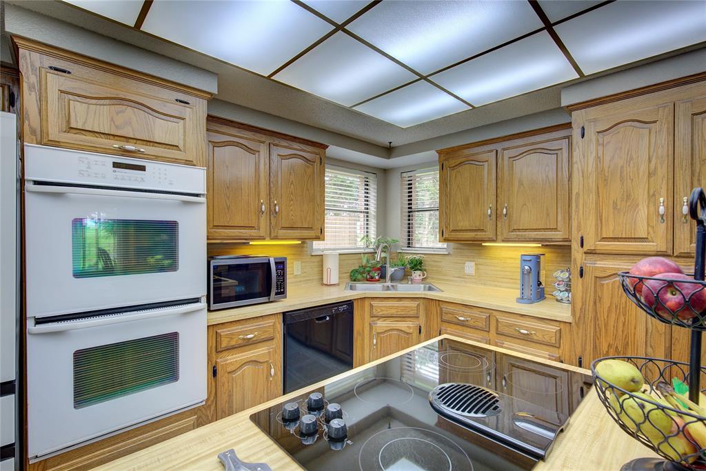 753 County Rd SW 3110 Mount Vernon, TX 75457 - Photo 12 of 40 Kitchen has corner sink with two windows, all electric appliances, lots of storage!