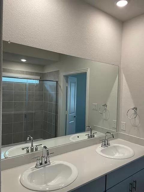 3008 Kingsgarden Road Denton, TX 76207 - Photo 7 of 9 a bathroom with a sink and a mirror
