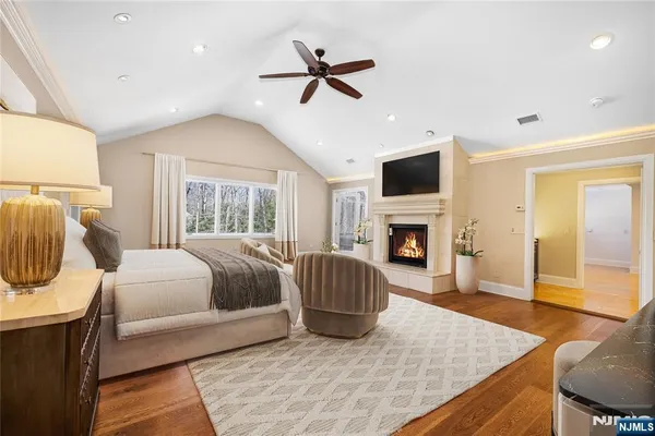 a bedroom with a bed and a fireplace