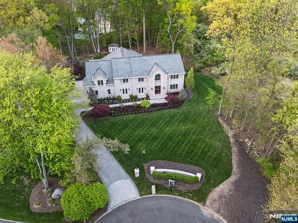 a aerial view of a house with a yard