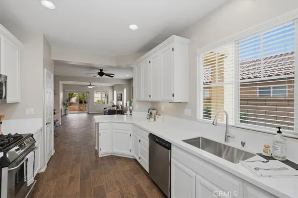 a kitchen with a sink stove and cabinets