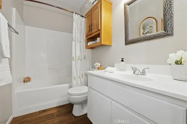 a bathroom with a sink a toilet and a bathtub