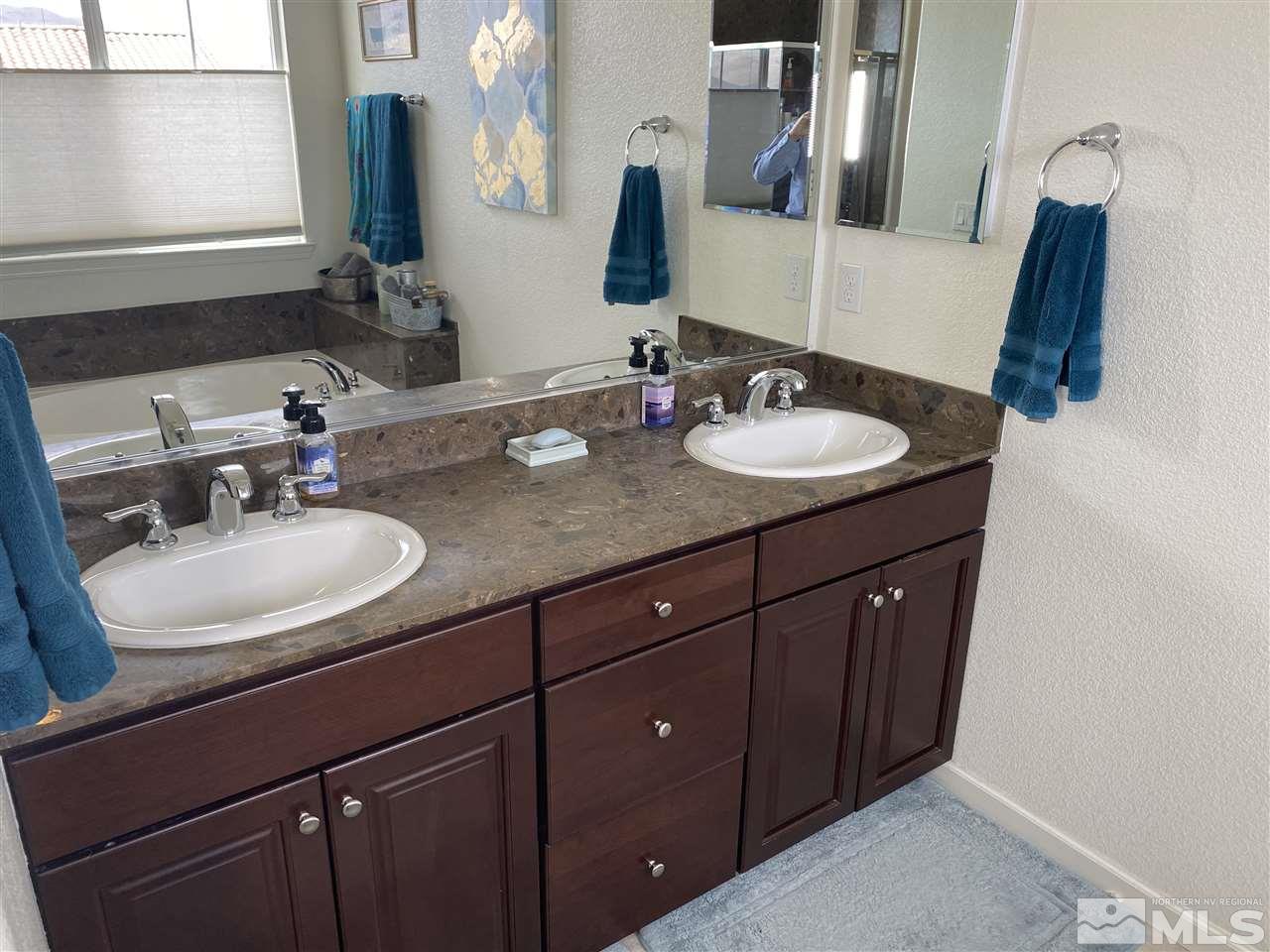 10748 Ridgebrook Drive Reno, NV 89521 - Photo 10 of 20 a bathroom with a sink and a mirror