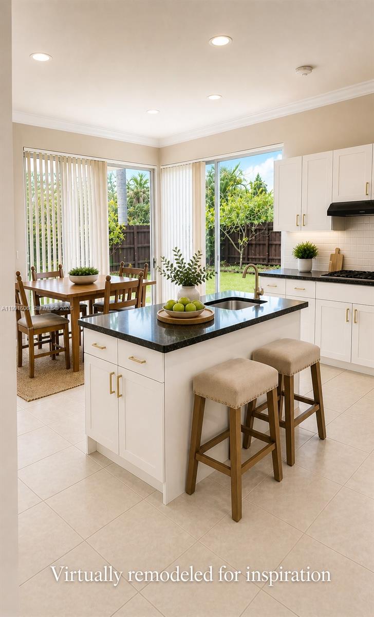 15615 Southwest 42nd Terrace Miami, FL 33185 - Photo 12 of 28 a kitchen with a sink and white cabinets