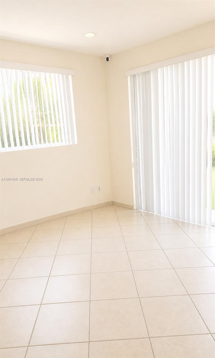 15615 Southwest 42nd Terrace Miami, FL 33185 - Photo 14 of 28 an empty room with windows