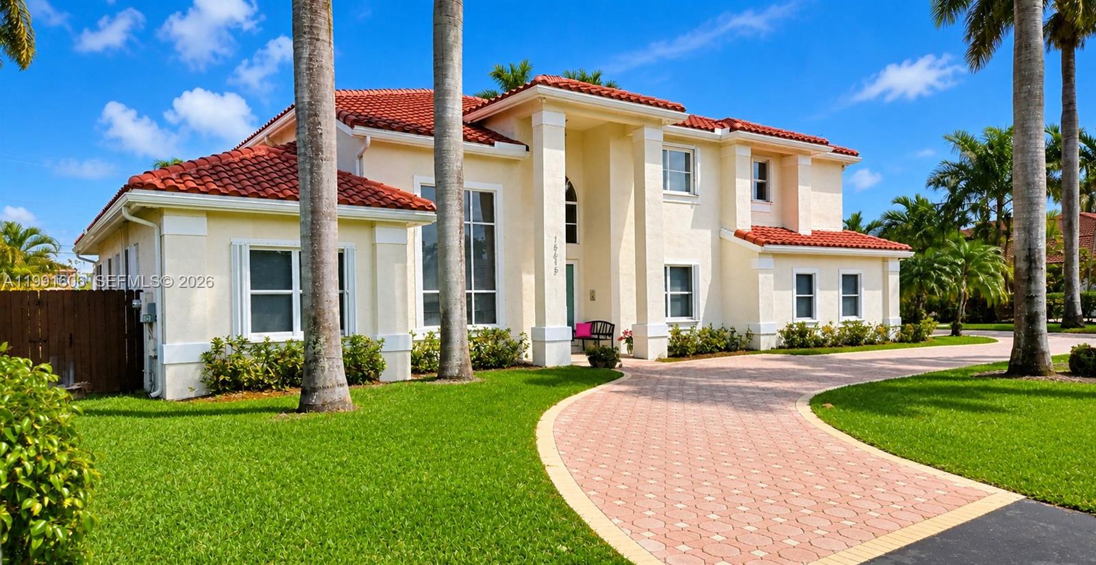 15615 Southwest 42nd Terrace Miami, FL 33185 - Photo 2 of 28 a front view of a house with a yard