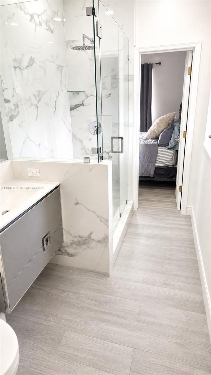 15615 Southwest 42nd Terrace Miami, FL 33185 - Photo 23 of 28 a view of a bathroom with a tub sink and a mirror