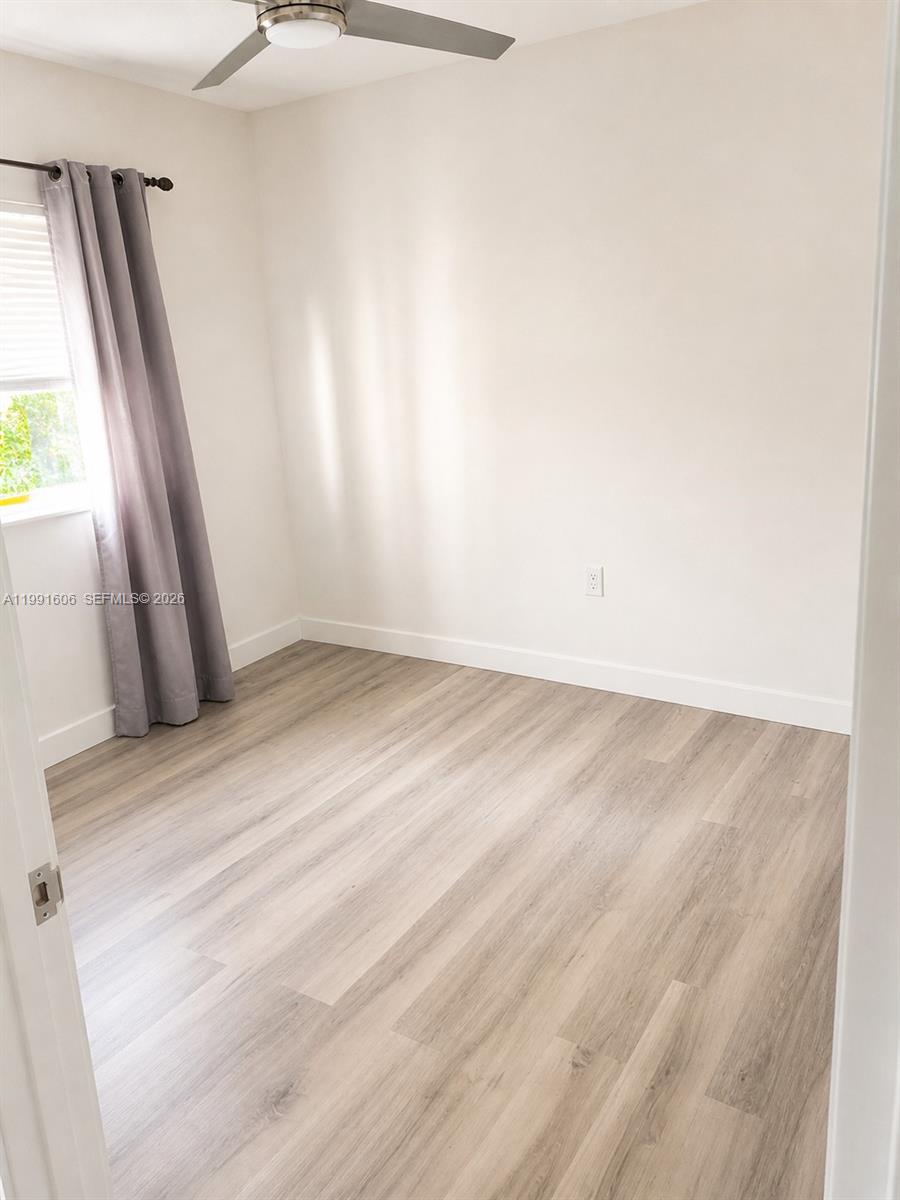15615 Southwest 42nd Terrace Miami, FL 33185 - Photo 24 of 28 wooden floor in an empty room