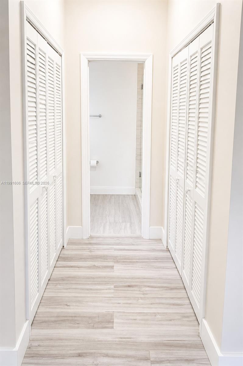 15615 Southwest 42nd Terrace Miami, FL 33185 - Photo 26 of 28 a view of a bedroom with wooden floor and stairs
