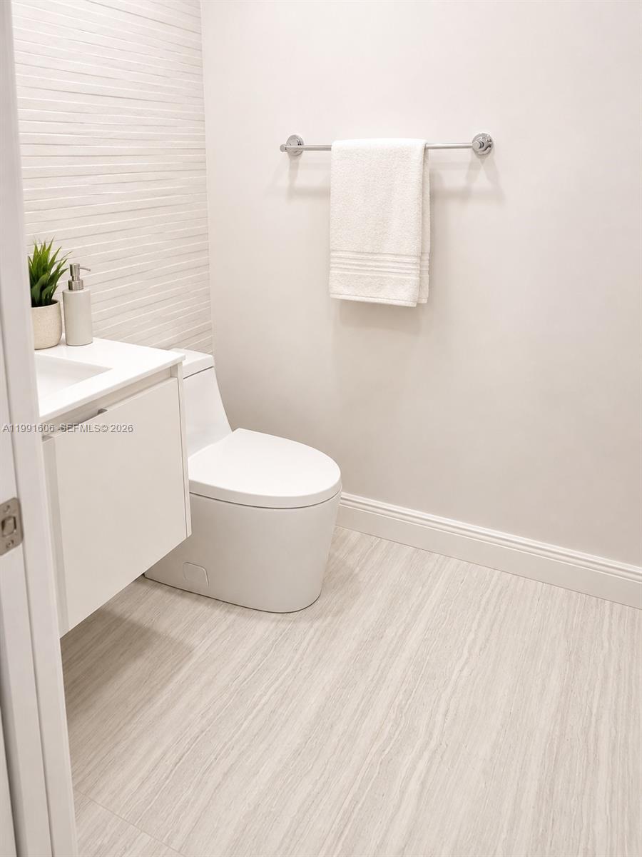 15615 Southwest 42nd Terrace Miami, FL 33185 - Photo 27 of 28 a white toilet sitting next to a white sink