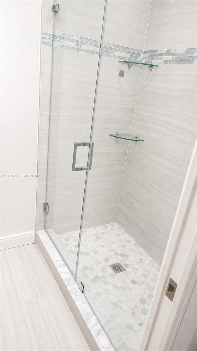 15615 Southwest 42nd Terrace Miami, FL 33185 - Photo 28 of 28 a bathroom with a bathtub and shower