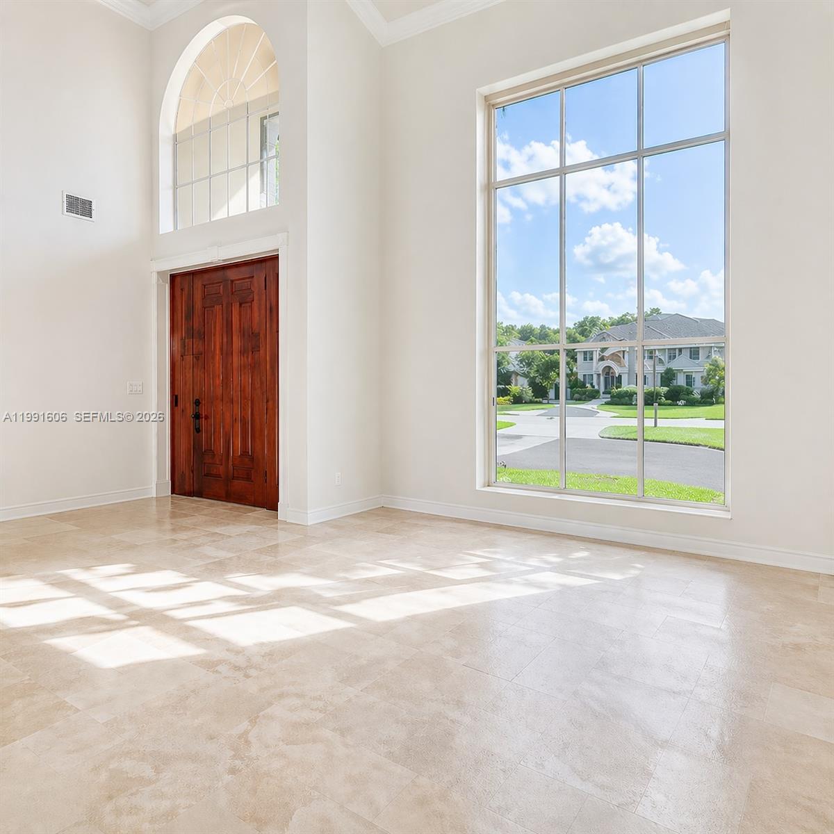 15615 Southwest 42nd Terrace Miami, FL 33185 - Photo 5 of 28 a view of an empty room with a window