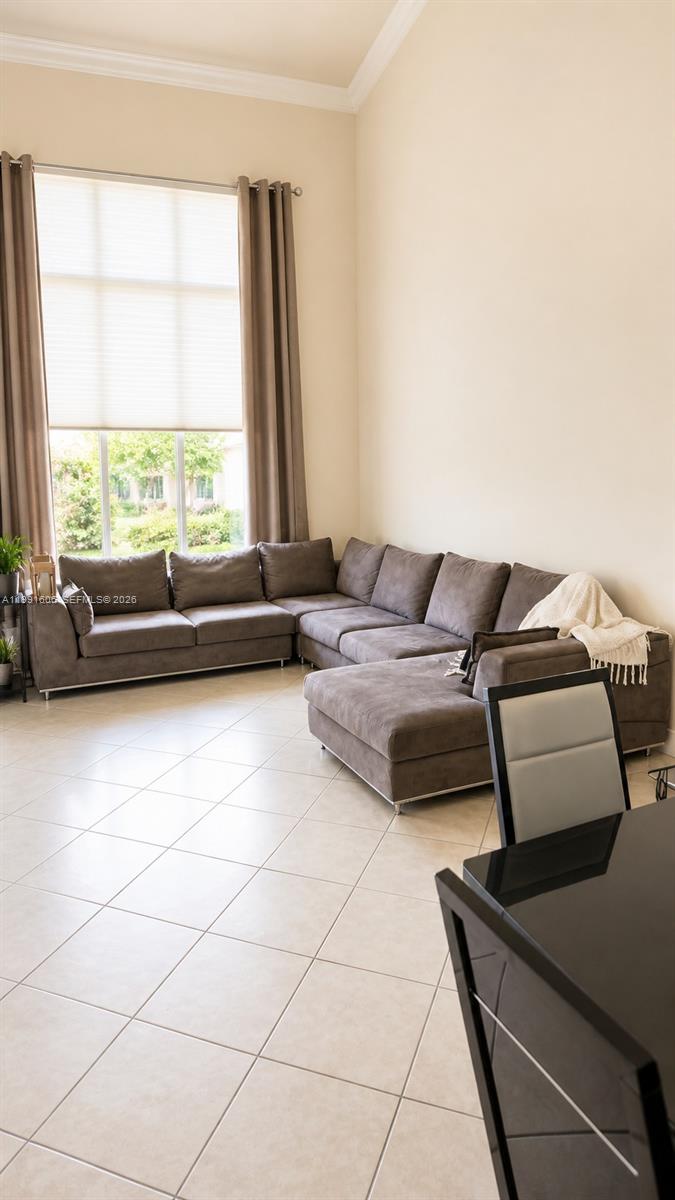 15615 Southwest 42nd Terrace Miami, FL 33185 - Photo 6 of 28 a living room with furniture and a window